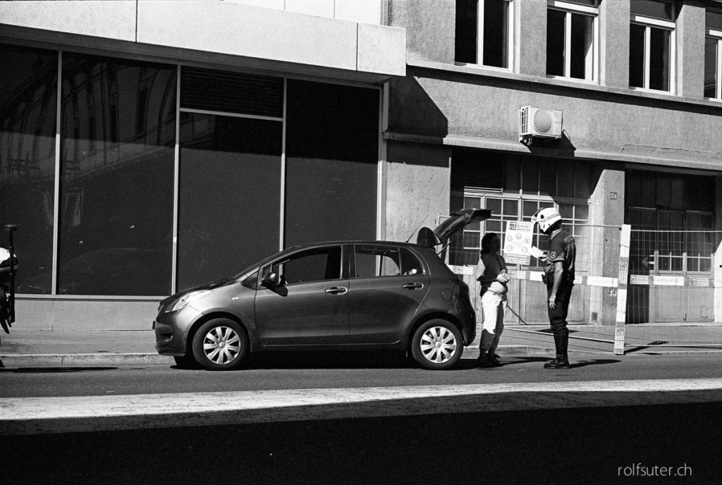 Policeman with helmet giving a fine, Lausanne