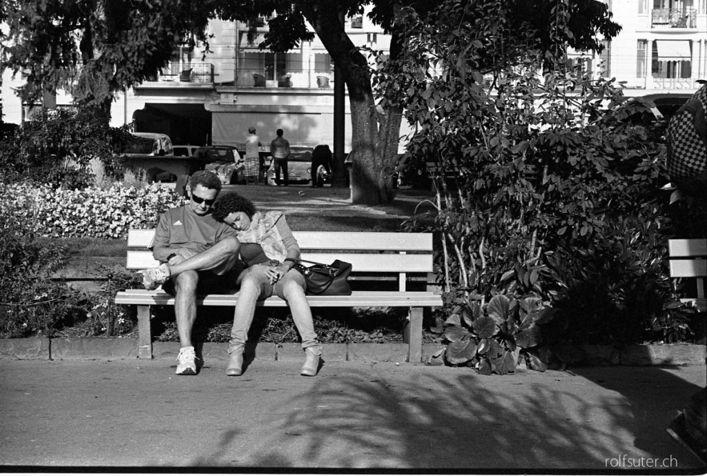 Tired sleeping on a bench in Montreux